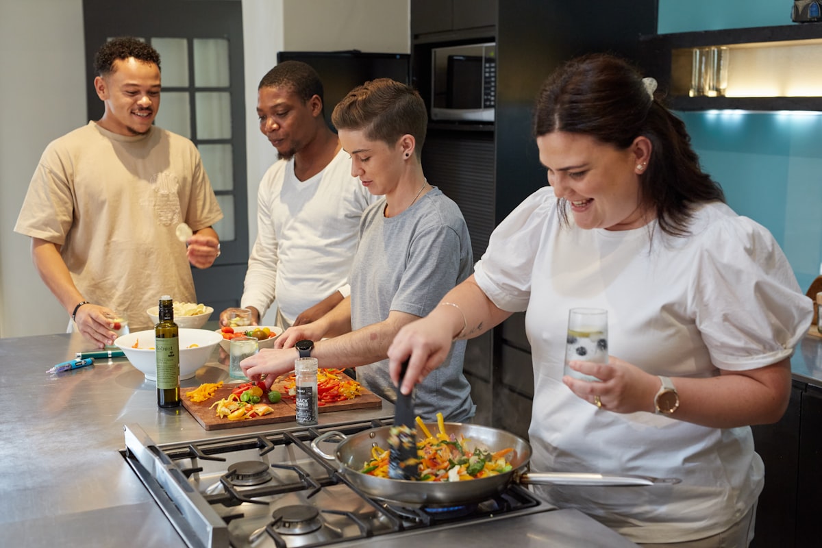 Chef instructor demonstrating cooking technique